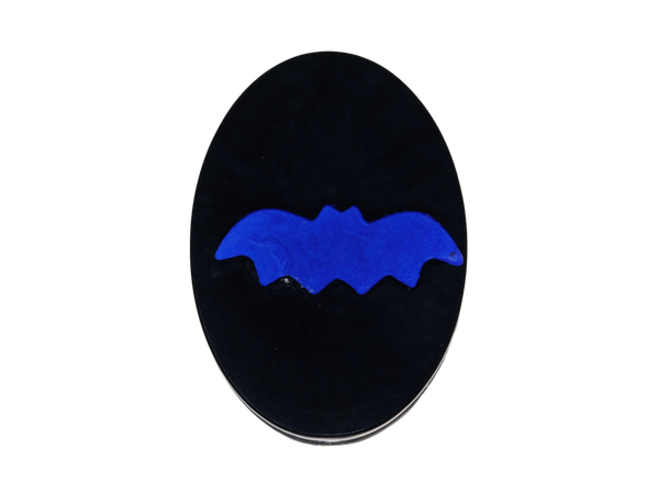 black oval soap with purple bat