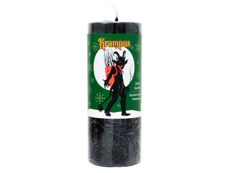 Black candle with a green label featuring Krampus design on a white background