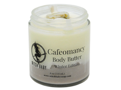 brown and white body butter topped with petrified wood in a 4 oz glass jar. Clear label reads: Cafeomancy Body Butter. Winter edition. 