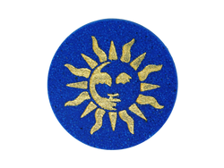navy blue circular bath bomb with 90s style whimsigothic gold sun air brushed on top