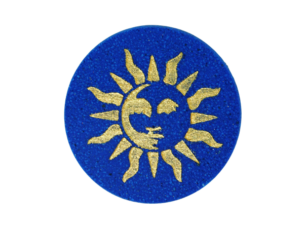 navy blue circular bath bomb with 90s style whimsigothic gold sun air brushed on top
