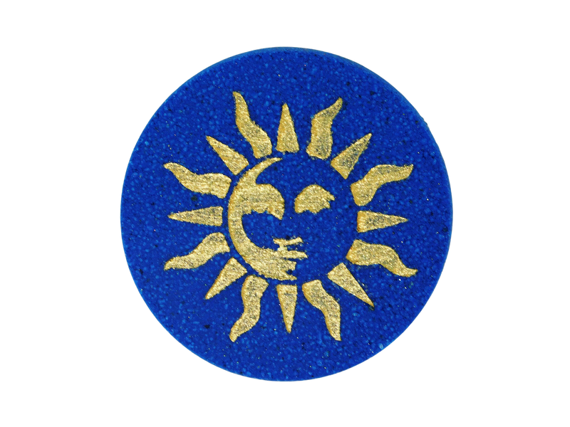 navy blue circular bath bomb with 90s style whimsigothic gold sun air brushed on top