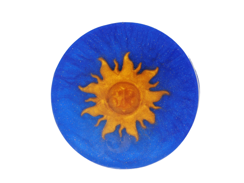 navy blue soap crafted in 90s whimsy goth style with golden sun on top