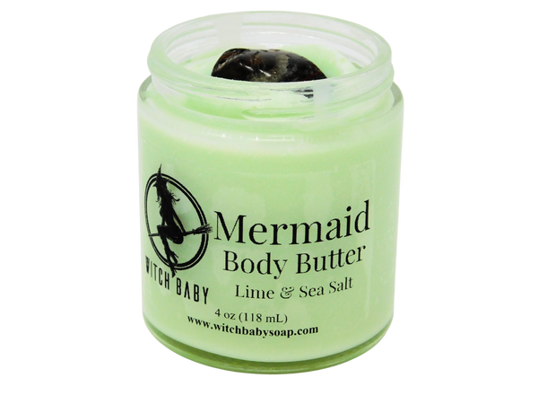 green body butter in 4 oz glass jar topped with sea jasper with label that reads: Mermaid Body Butter. Lime & Sea Salt.