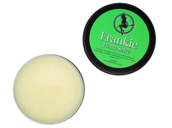 opened container of frankie hand salve exposing white salve inside 2 oz black tin with green label that reads: Frankie Hand Salve and has ingredients listed below