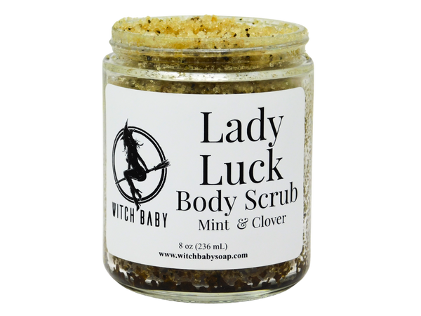 green speckled matcha coloreds sugar body scrub in a glass 8 oz jar with a label that reads: Lady Luck Body Scrub. Mint & Clover.