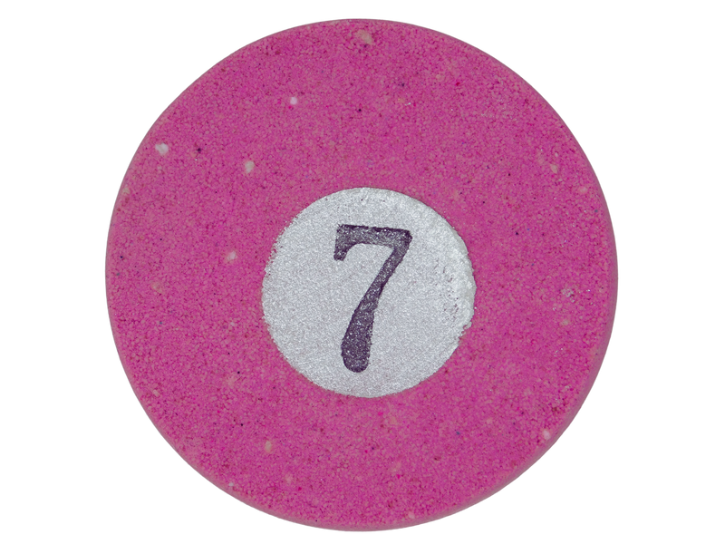 circular bath bomb fashioned to look like a pink #7 pool ball