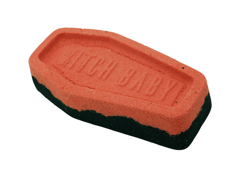 side view of red and black coffin bath bomb