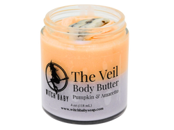 orange and purple body butter topped with crazy lace agate in a 4 oz glass jar with a clear label that reads: The Veil Body Butter. Pumpkin & Amaretto.
