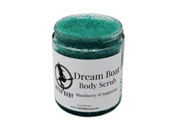 aqua blue granular scrub in a glass 8 oz jar with a white label that reads: Dream Boat Body Scrub. Blackberry & Sugarcane. 