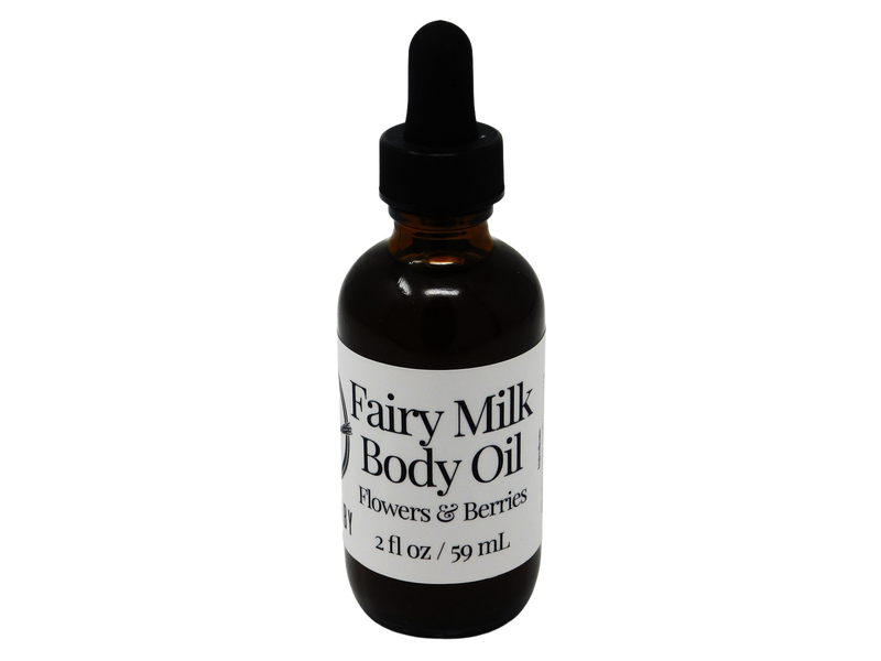 2 oz brown dropper bottle with white label that reads: Fairy Milk Body Oil. Flowers & Berries. 