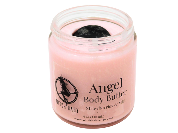 pink body butter packaged in  4 oz glass jar topped with rhodonite with a clear label that says "Angel Body Butter. Strawberries & Milk."