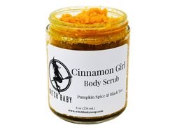 Pumpkin orange granulated body scrub packaged in a 8 oz (236 mL) glass jar.  White label reads: Cinnamon Girl Body Scrub. Pumpkin Spice & Black Tea. 