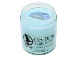 4 oz glass jar of baby blue Cry Baby body butter topped with a blue lace agate crystal