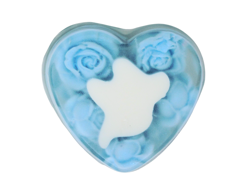 Clear heart shaped soap filled with pastel blue roses and a white ghost in the center.