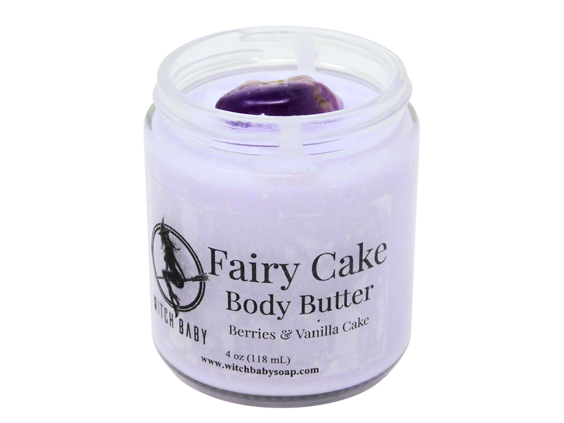 Purple body butter topped with amethyst packaged in a 4 oz glass jar  with a clear label that reads: Fairy Cake Body Butter. Berries & Vanilla Cake.