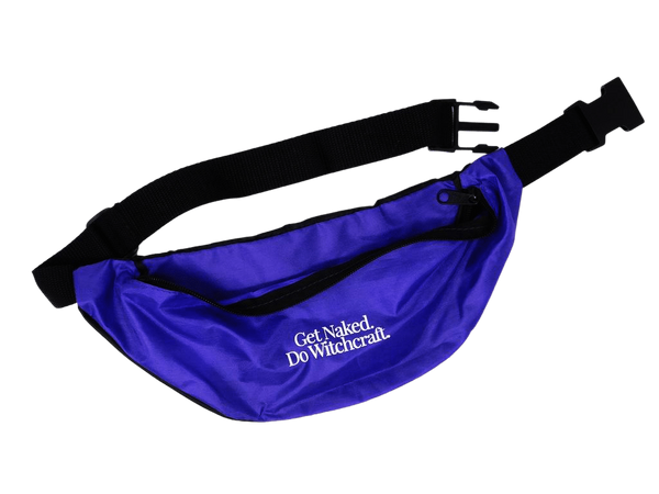 Photo of a royal purple fanny pack with adjustable black straps and plastic clips that reads "Get Naked. Do Witchcraft'"