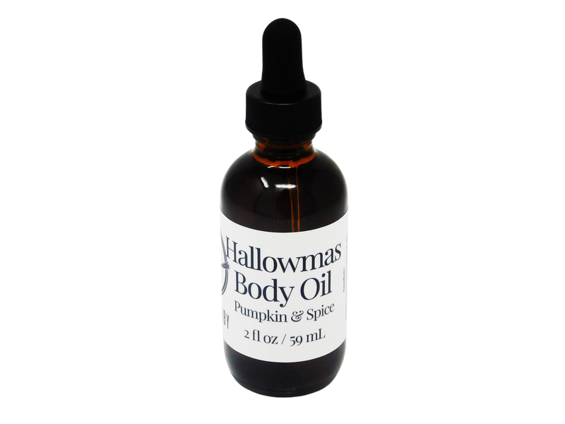 Amber colored 2 oz dropper bottle. Label says Hallowmas Body Oil Pumpkin and Spice