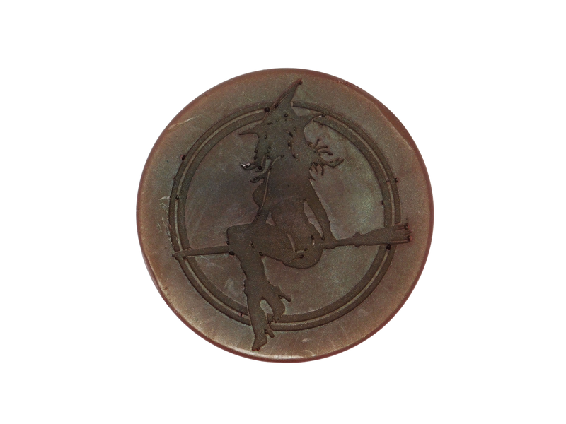 circular brown soap with witch baby logo on top