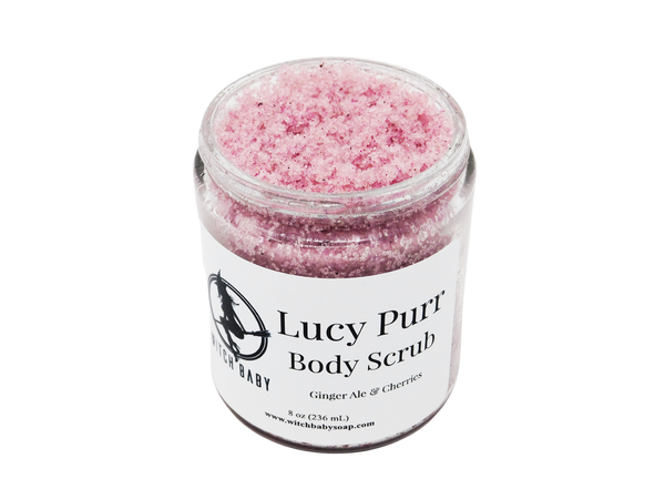 speckled pink sugar scrub in 8 oz glass jar with white label that reads: Lucy Purr Body Scrub. Ginger Ale & Cherries.