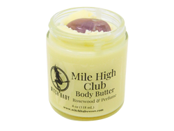 yellow body butter in 4 oz glass jar with a label that reads: Mile High Club Body Butter. Rosewood & Perfume. 