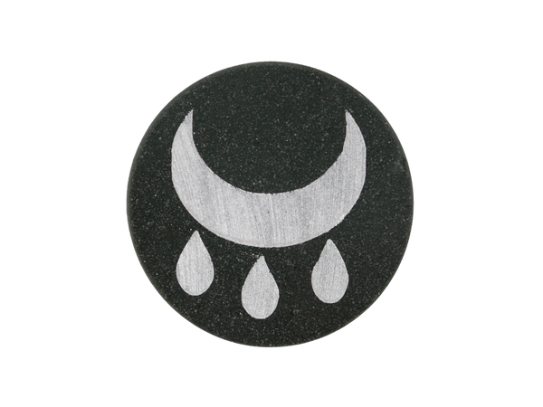 black circle bath bomb with silver wiccan blessing symbol on top