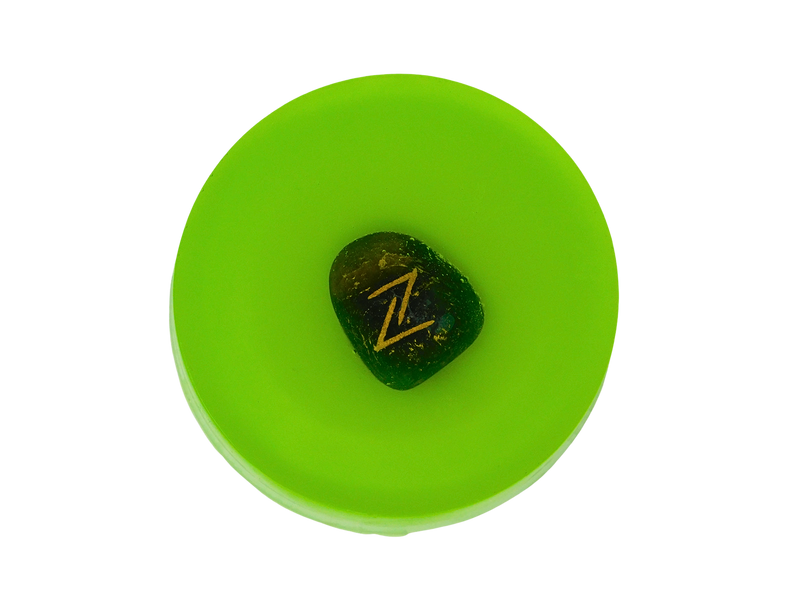 circular soap green in color with rune stone on top 