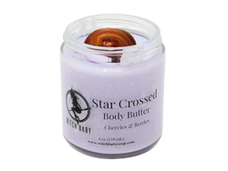 light purple body butter topped with a carnelian crystal in a 4 oz  glass jar with a clear label that says Star  Crossed Body Butter. Cherries & Berries. 